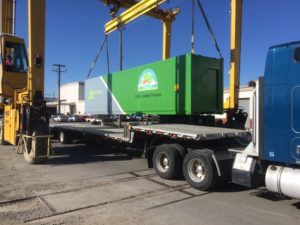 Containerized growing system unit (hydroponic farm) getting loaded for shipping